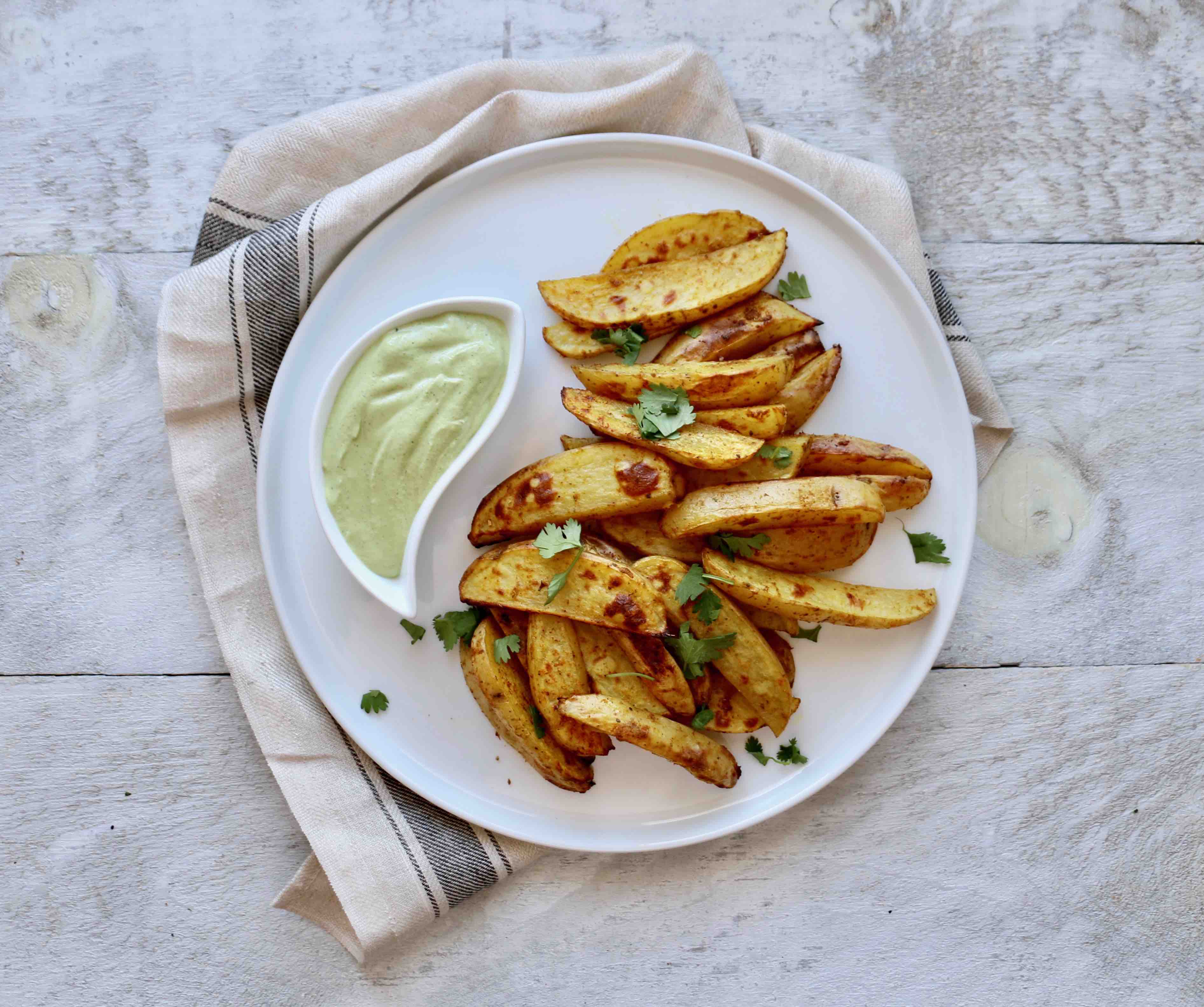 Roasted curry potato wedges with cilantro lime dipping sauce